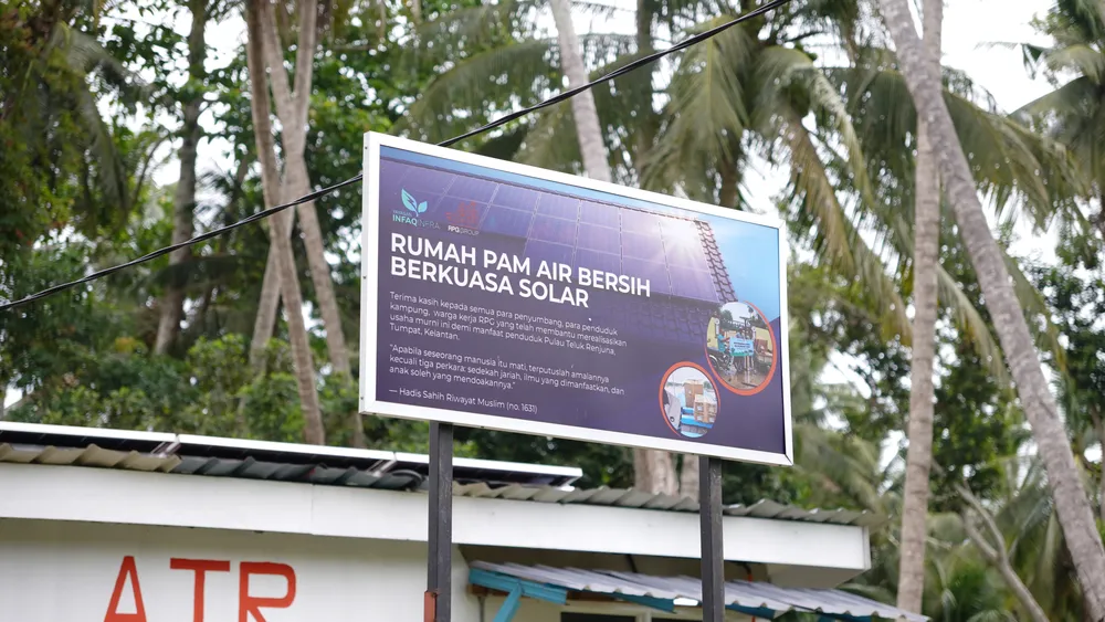 Official project signboard for the solar-powered clean water pump house project on Pulau Teluk Renjuna