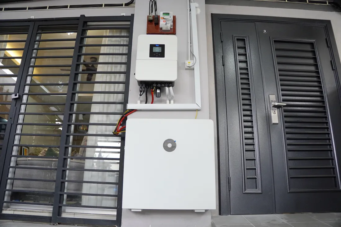 Completed hybrid inverter and battery installation mounted on an interior wall in Gombak